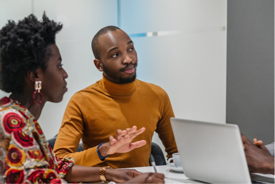 An image of an african american man and woman sitting in a business meeting