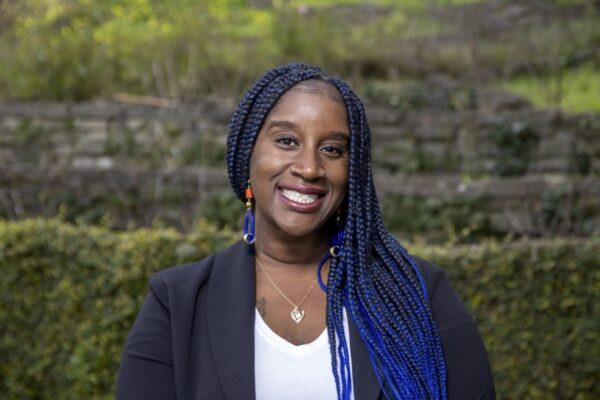 Gabriella Johnson, founder of Soul Work Healthcare, smiles for a portait.