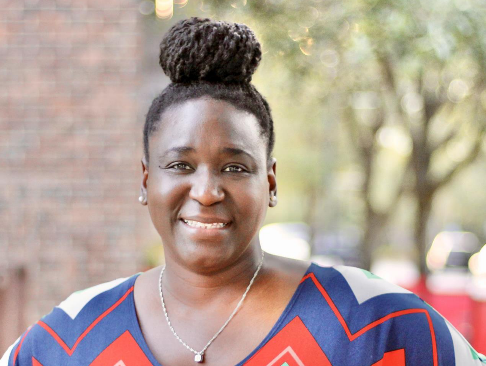 Tembi Gray, founder of GMG Performing Arts Center, smiles for her portrait.