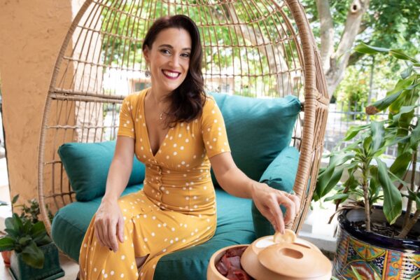 Entrepreneur Sandra Portal-Andreu enjoys chips and dip from her company's sustainable container for small bites.