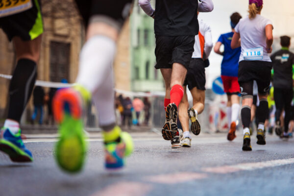 Runner's feet pound the pavement during a marathon