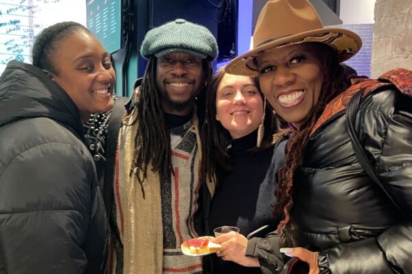 NYC entrepreneurs enjoy wine, snacks, and networking at a festive seasonal event.